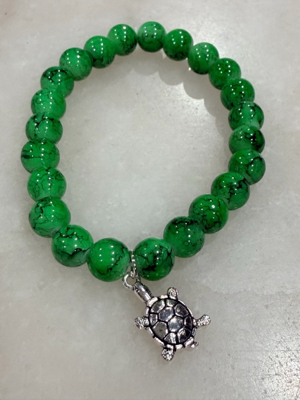 Green Beaded Stretch Bracelet with Silver Turtle Charm
